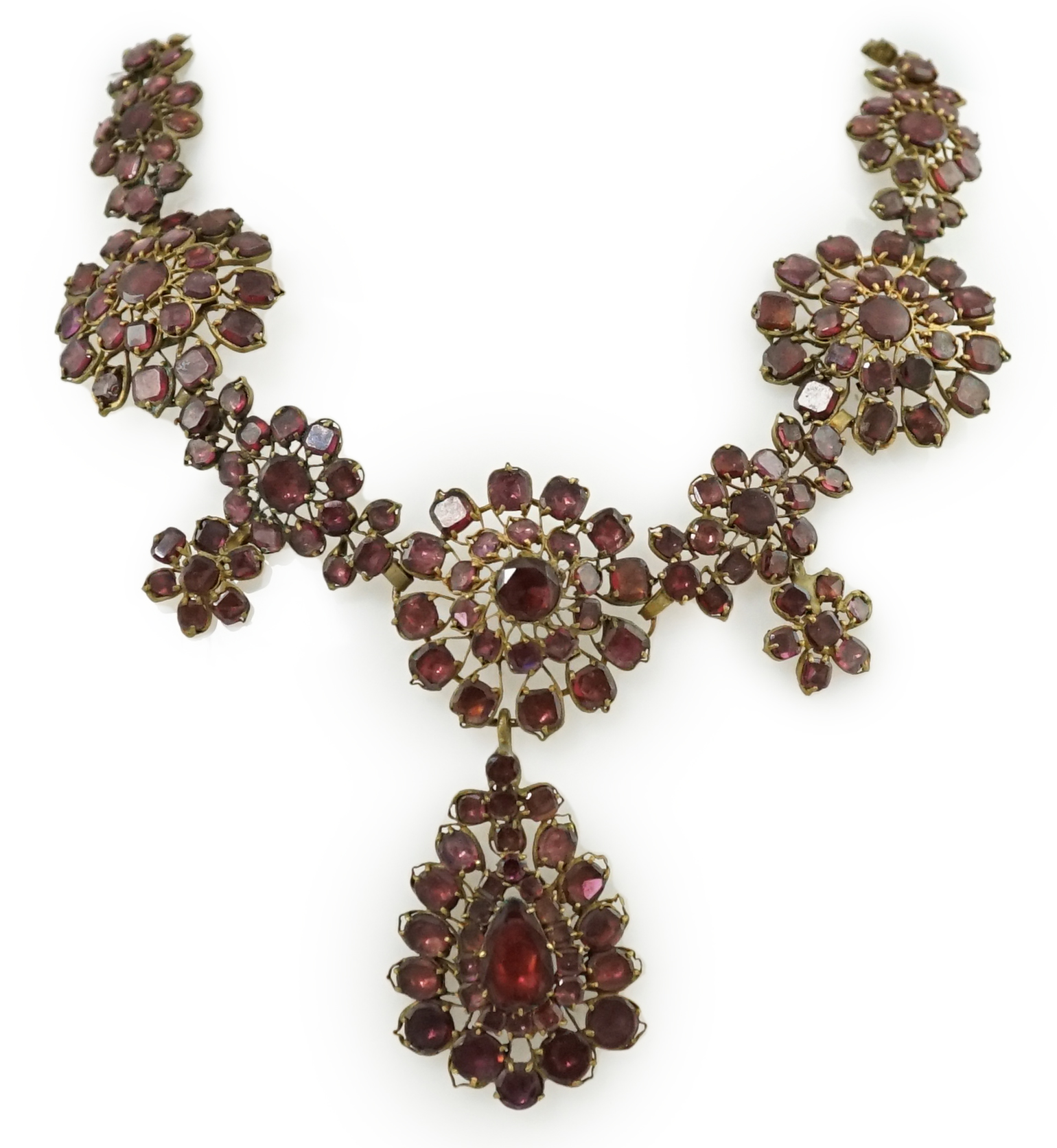 A good 18th century gilt metal and foil backed garnet cluster drop necklace, in original box